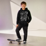 Unisex-Witch-Cat-Kickflip-Halloween-Skateboard-Graphic-T-Shirt-for-Cat-Lovers.png